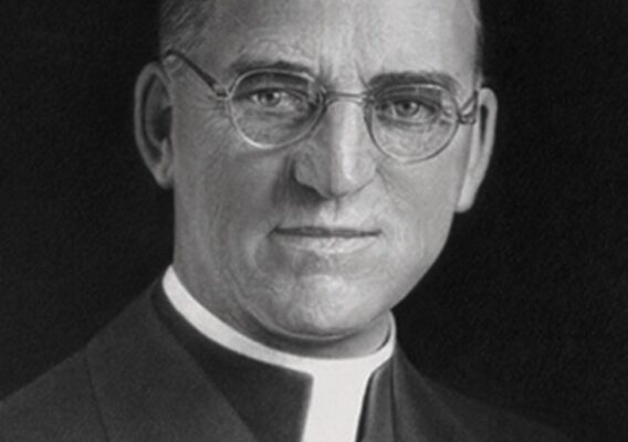 Portrait of a man wearing glasses and a clerical collar, representing a historical religious figure known for his contributions to society and faith.