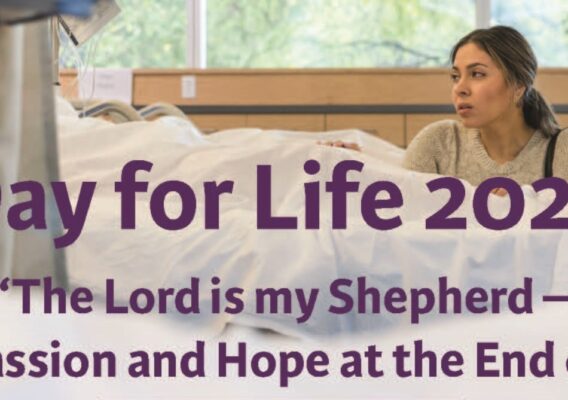 Image depicting a thoughtful woman sitting beside a hospital bed, participating in the Day for Life 2024 event, themed 'The Lord is my Shepherd – Compassion and Hope at the End of Life'. The setting reflects a compassionate atmosphere focused on end-of-life care.